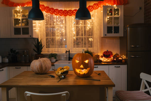 istock Kitchen with  beautiful Halloween pumpkin decorations with lights 1503326783