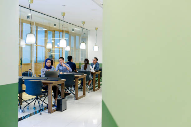 istock A diverse group of Asian and multiracial white-collar workers is busy working in an open-plan co-sharing office. 1503326949