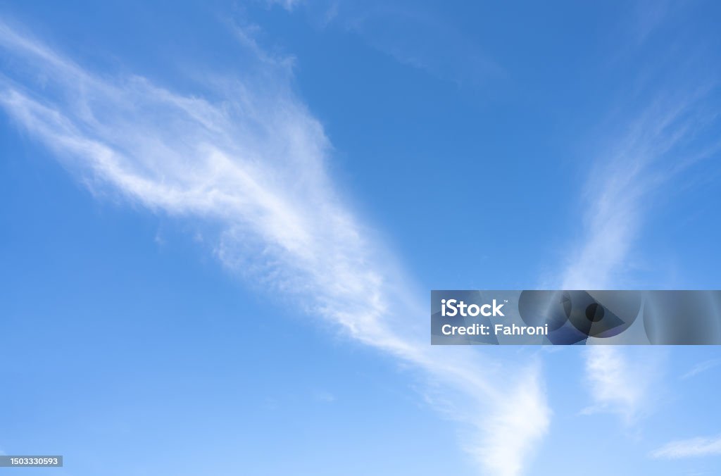 Blue sky and white cirrocumulus clouds texture background. Blue sky on sunny day. Summer sky. Cloud formation. Fluffy clouds. Nice weather in summer season. Weather pattern. Atmospheric phenomenon. Abstract Stock Photo