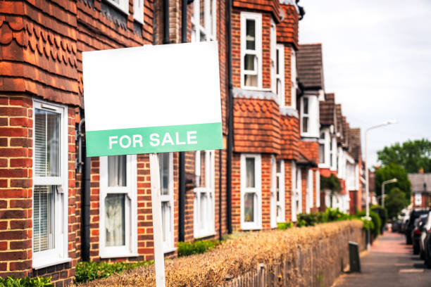 istock For Sale sign on terraced street 1503330697