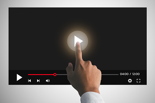the man touching play icon on video online. video content creator concept.