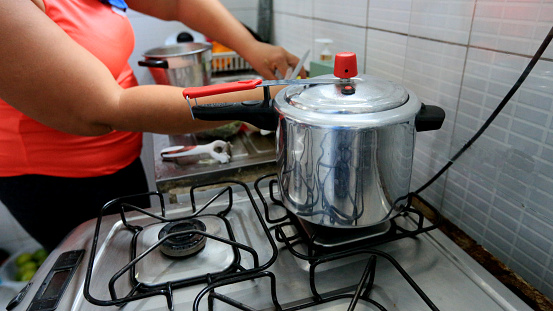 salvador, bahia, brazil - june 9, 2023: pan is seen on a kitchen stove in the city of Salvador.