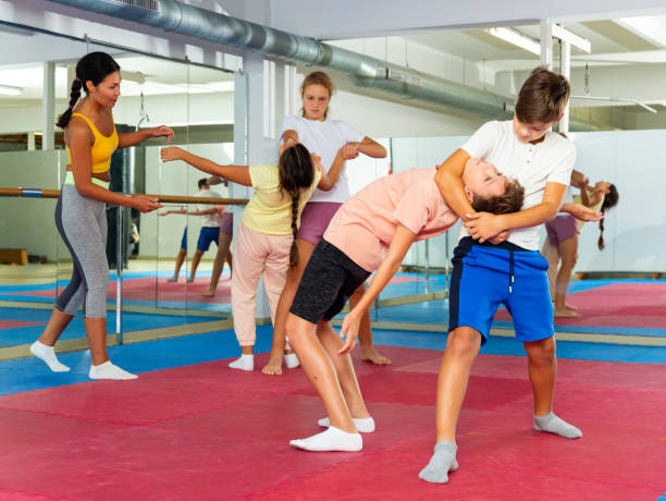 istock Kids in pair exercising self-defense movements 1503343186