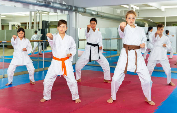istock Kids in karate uniform performing kata 1503343196