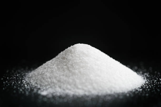 istock heap of extra small salt on black background 1503343248