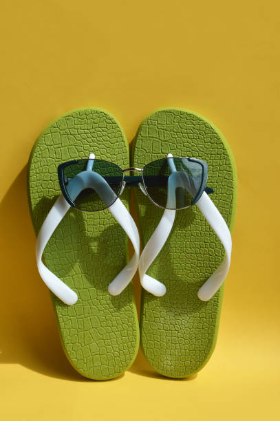istock summer beach shoes, flip-flops for relaxation. background for the design. preparing for a trip to the sea 1503348492
