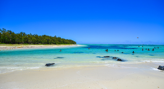 Relaxing beach on Ile aux Cerfs Leisure Island, Mauritius. This island is a popular destination that attracts European tourists in the summer.