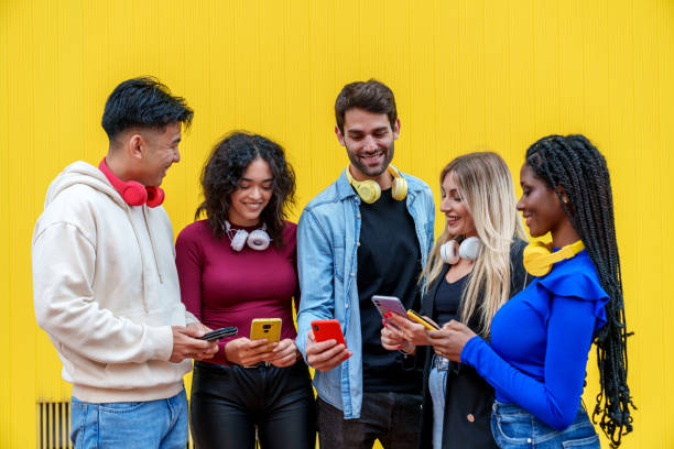 istock Vibrant Multicultural Bond: Five Friends Immersed in Joyful Chatting, Embracing Diversity on a Lively Yellow Background 1503352081