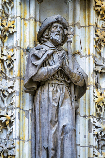 Ancient religious saints in the Seville Cathedral exterior facade, Spain