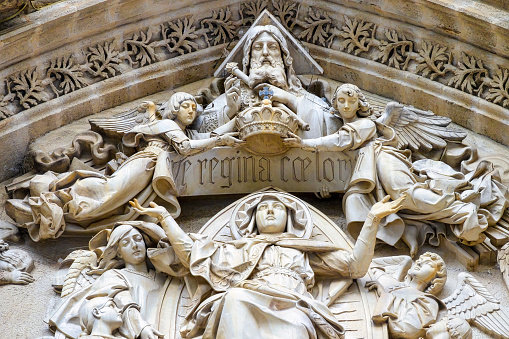 Stone ornaments in the door of the Seville Cathedral exterior facade, Spain