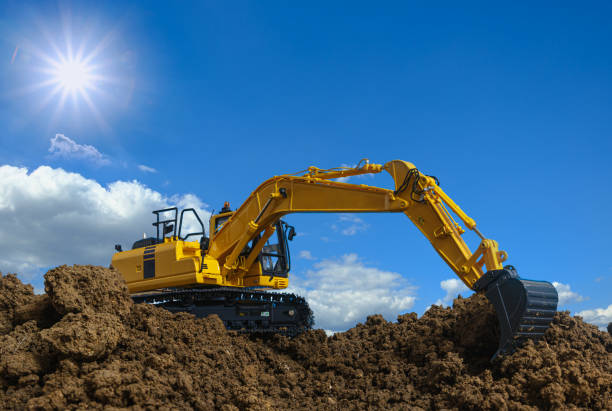 istock Yellow excavators are digging the soil in the construction site. 1503353916
