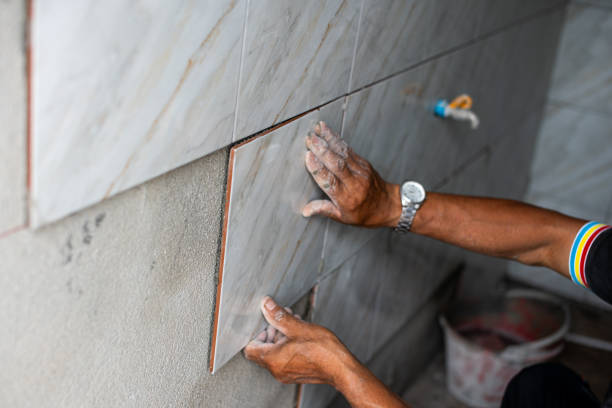 istock Professional Thai builder, tiler, laying ceramic tiles on walls, bathrooms 1503354321