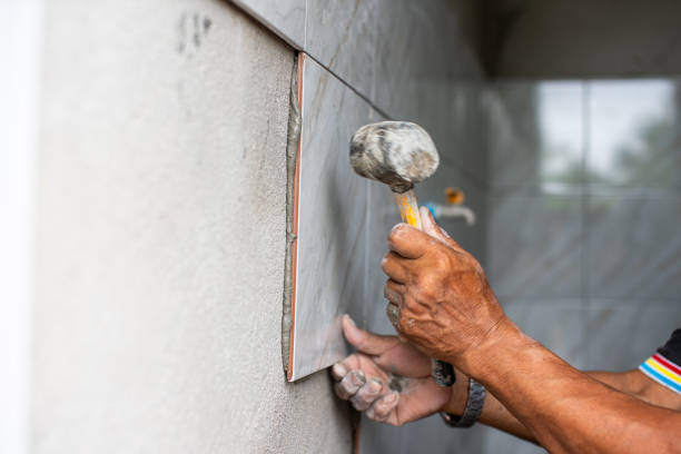 istock Professional Thai builder, tiler, laying ceramic tiles on walls, bathrooms 1503354377