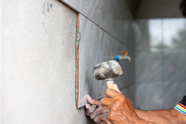 istock Professional Thai builder, tiler, laying ceramic tiles on walls, bathrooms 1503354396