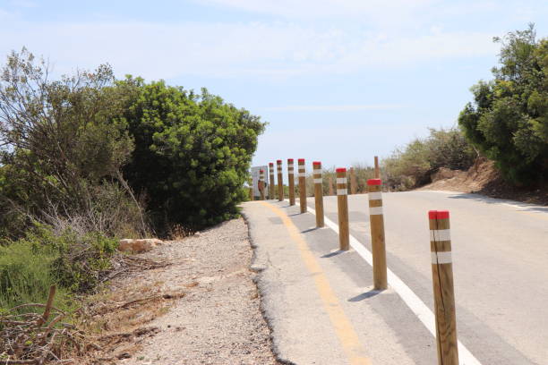 wooden posts by the road stock photo