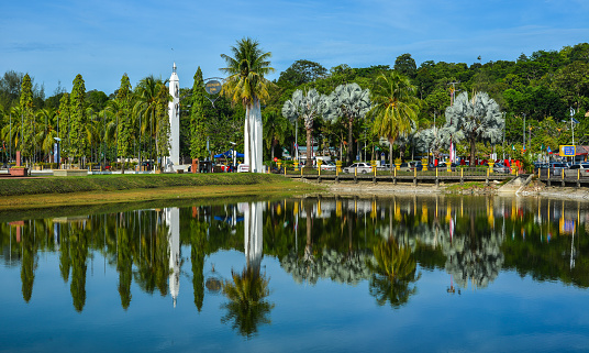 Langkawi, Malaysia - May 1, 2018. Reflection lake with city park at summer day in Langkawi, Malaysia.