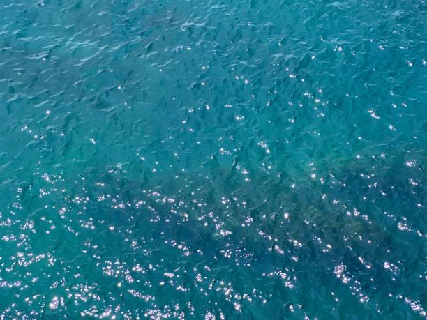 istock Blue ocean water glittering shiny surface aerial view. 1503356600