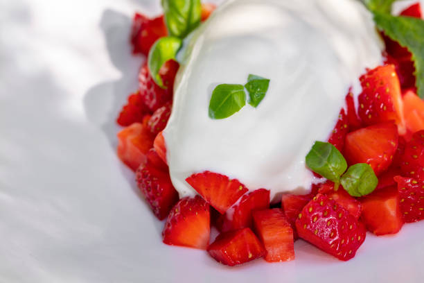 istock Vanilla ice cream with strawberries and basil 1503358473