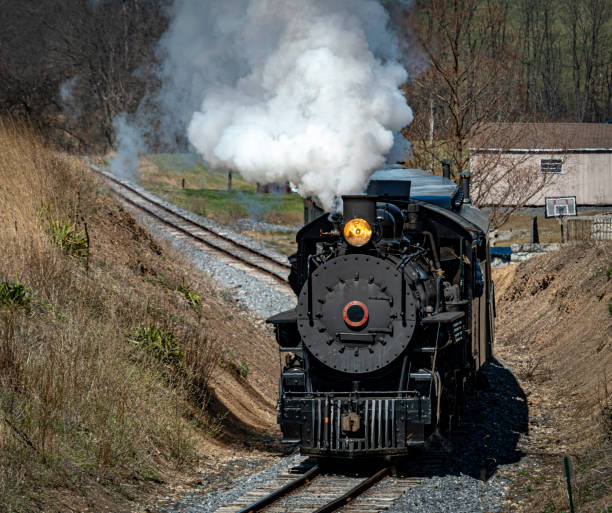 istock Front and Slightly Above View Approaching Restored Narrow Gauge Passenger Steam Train Blowing Smoke 1503360095