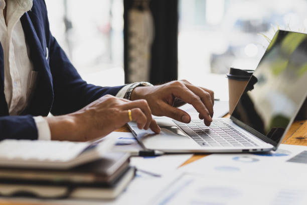 istock Businessman working on documents on the desk, data analysis of financial figures on laptop and business investments planning. 1503360197
