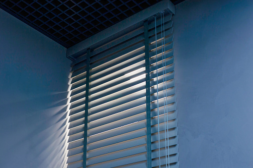 White Venetian blinds with sunlight and shadow. Window blinds. 3d rendering.