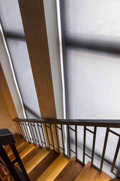 istock Roller blinds on floor-to-ceiling windows near the stairs 1503362144