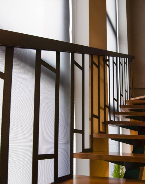istock Roller blinds on floor-to-ceiling windows near the stairs 1503362146