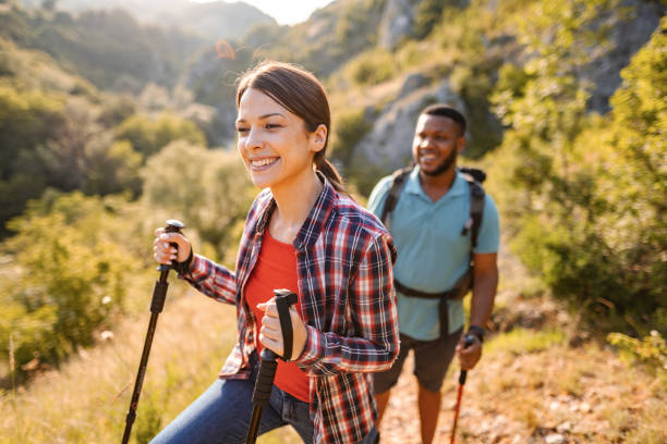 istock Young multiracial couple hiking on a mountain on a sunny day 1503363192