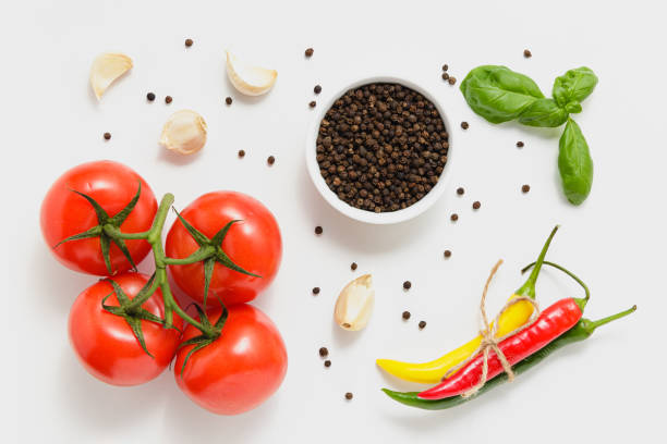 istock Tomatoes, green basil leaves and chili pepper on white background. 1503363445