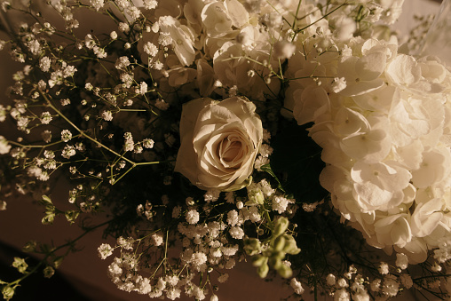 Detail of a flower bouquet with a white rose