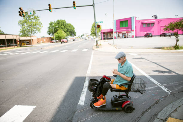 istock Senior on mobility scooter crossing the street 1503367186