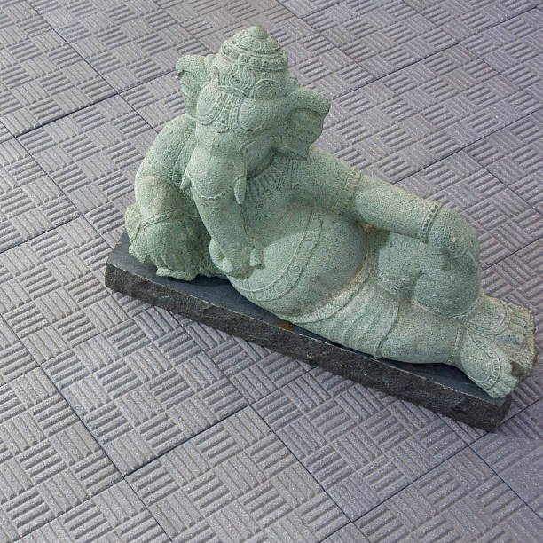 istock Beautiful  leaning lord ganesha statue sculpture 1503367968