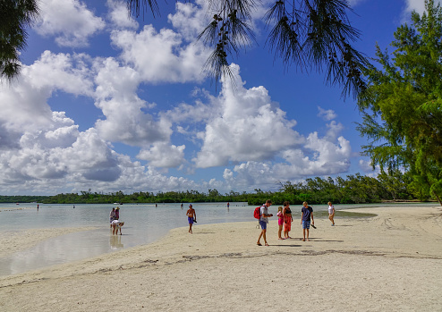 Flacq, Mauritius - Jan 12, 2017. People enjoy on Ile aux Cerfs Island, Mauritius. This island is a popular destination that attracts tourists in the summer.