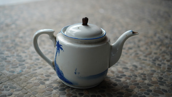 Japanese ceramic teapot, white background, space paste