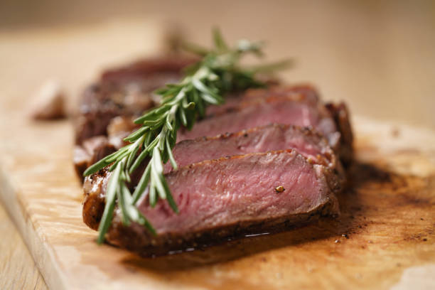 istock sliced medium rib eye steak with rosemary branch 1503369412