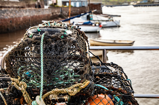 Fishermen lobster pots drying in the harbour at Shaldon, Devon.\n\nApril 2018