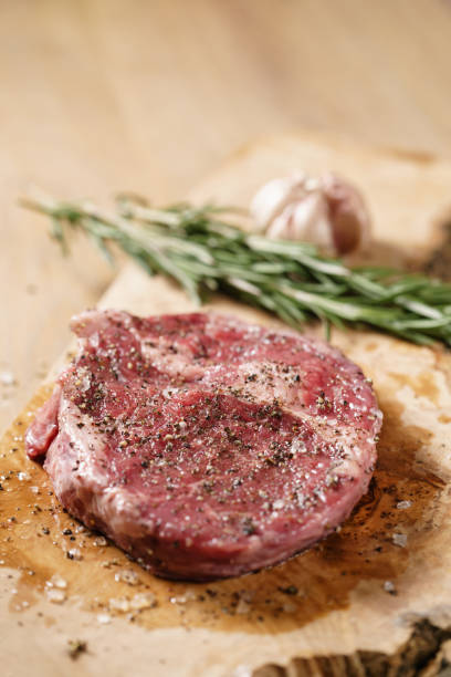 istock raw rib eye steak on board closeup 1503371170