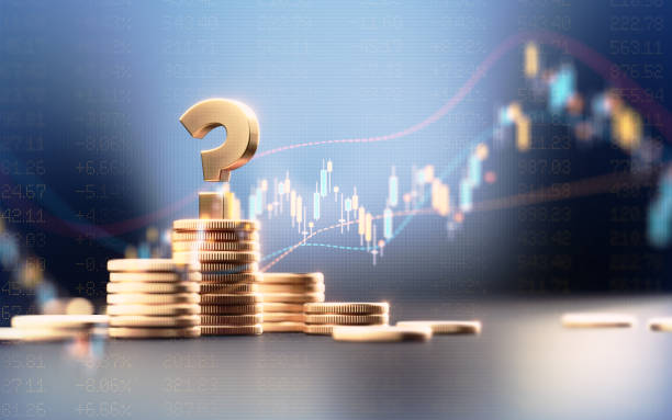 istock Question Mark On Top Of Coin Stacks Before Blue Financial Graph 1503371335