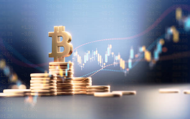 istock Bitcoin Symbol On Top Of Coin Stacks Before Blue Financial Graph 1503371417