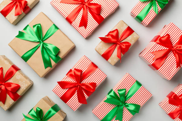 istock Christmas gift boxes on color background, top view 1503373213