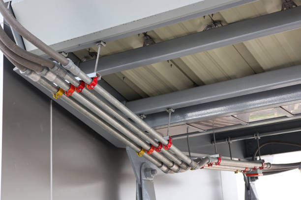istock Colored Identification on Clamps of the Electrical Cable Conduits 1503374020