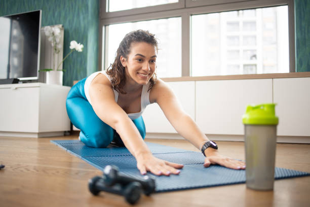 istock Young woman at home keeping fit by exercising 1503374672