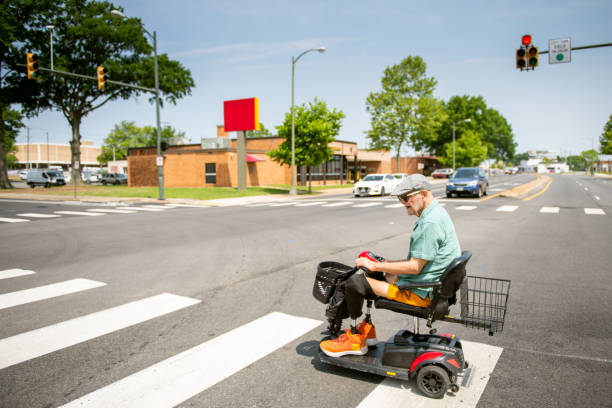 istock Senior on mobility scooter crossing the street 1503377219