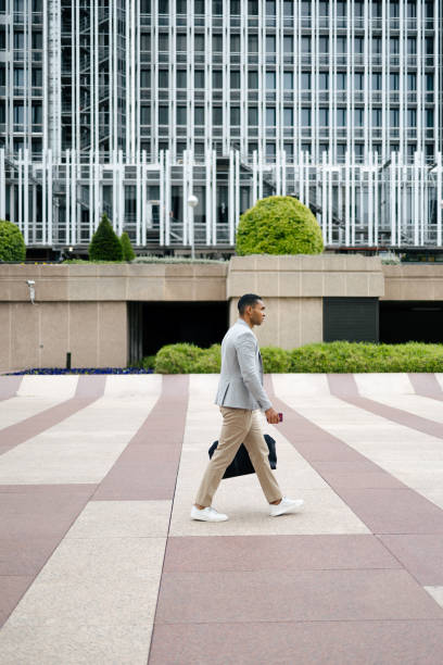 istock Man walking through financial area with briefcase 1503377416