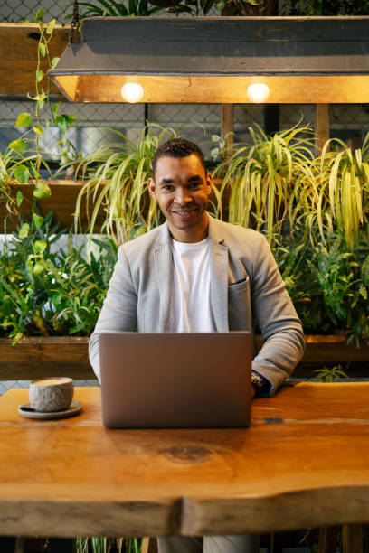 istock Man working on laptop at cafeteria 1503378803