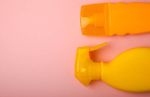 istock Sunscreen on a pink background. Plastic bottle of SPF sunscreen. Sunscreen selection.Summer travel beach flat lay composition, banner. Summer vacations and spf uv-protecting skin care concept. 1503389390