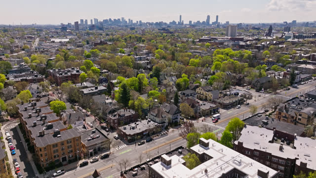 Drone Flight Over Cambridge on a Sunny Day with Boston Skyline in Distance
