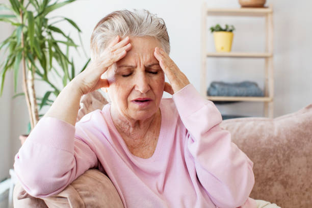 istock middle aged lady looking away sit alone at home feel anxious lonely, sad 1503391896