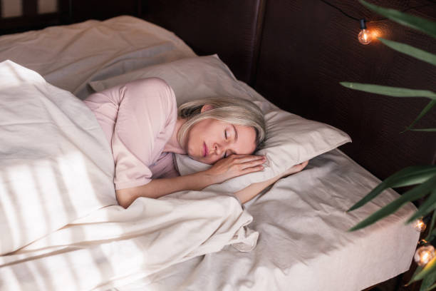istock Middle aged woman sleeping in cozy bed 1503391914