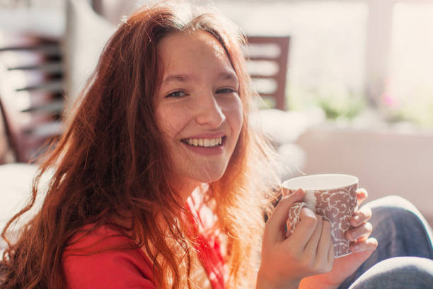 istock Young woman drinking coffee at home 1503392204